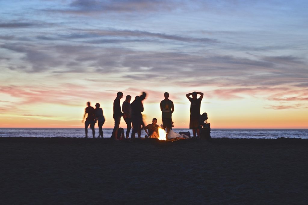 beach bonfire gathering people celebration